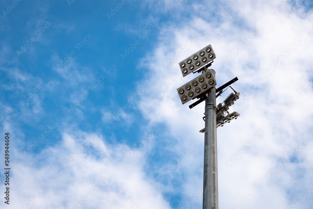 Powerful street light with 10 bulbs on each. Bright blue sky. Powerful street light with 10 bulbs on each. Bright blue sky.