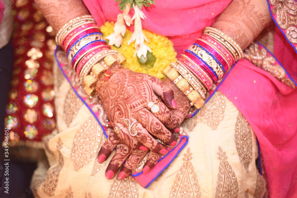 Fototapeta premium indian wedding, mehandi, holding hands, pooja, function, ritual, ring, marriage, traditional