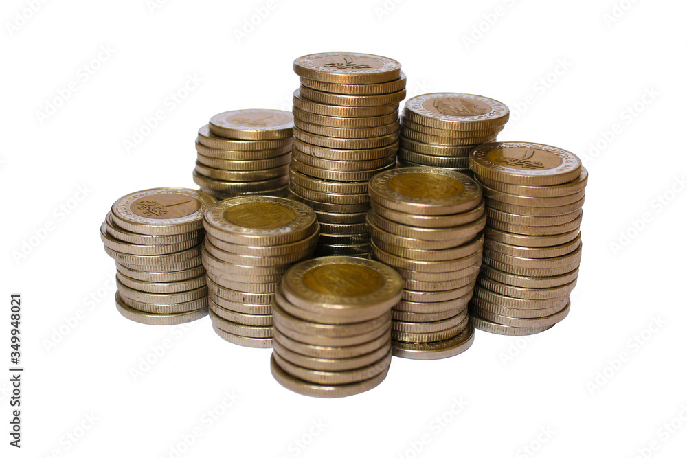 Stack of coins in denominations of one Egyptian pound. Isolated silver coins on a white background. Wealth and financial activities. Stack of coins in denominations of one Egyptian pound. Isolated silver coins on a white background. Wealth and financial activities.