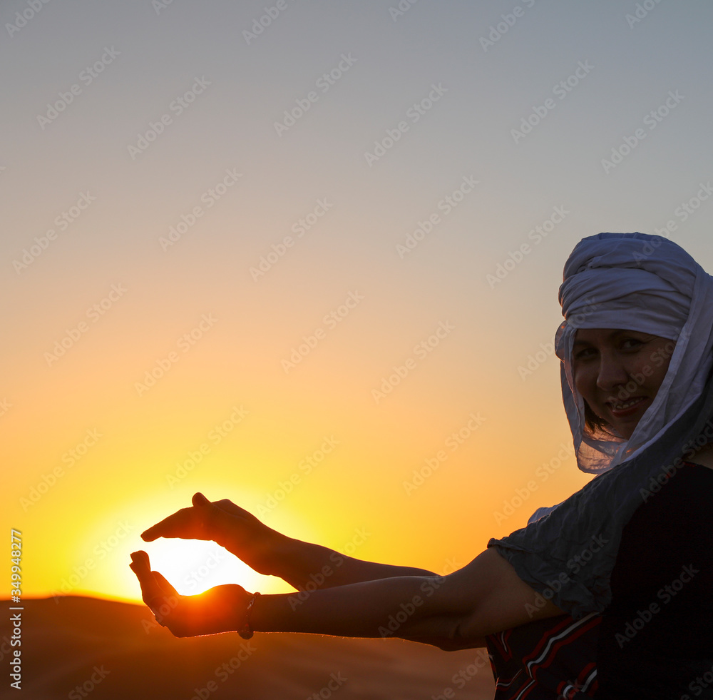 The sun is in hand.  Desert in Morocco.
