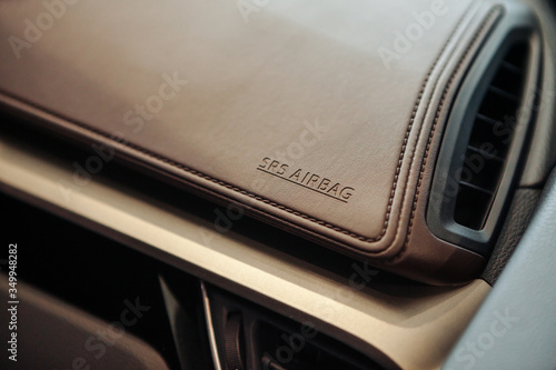 Closeup of airbag cover on auto dashboard.