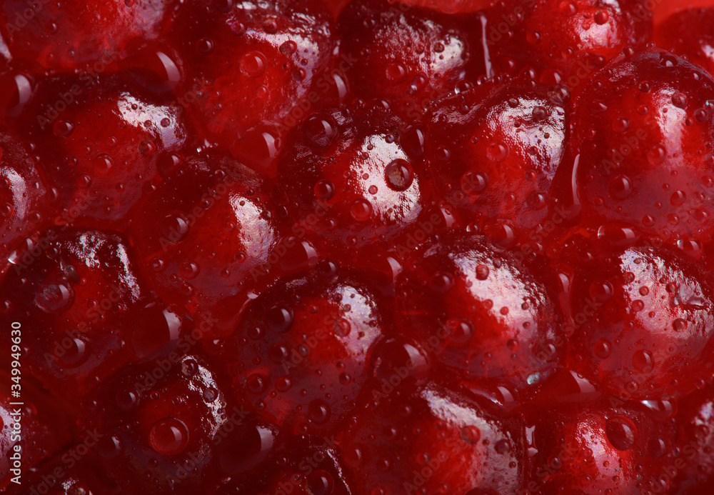 Ripe red kernels of the pomegranate with water droplets extreme close-up. Ripe red kernels of the pomegranate with water droplets extreme close-up.