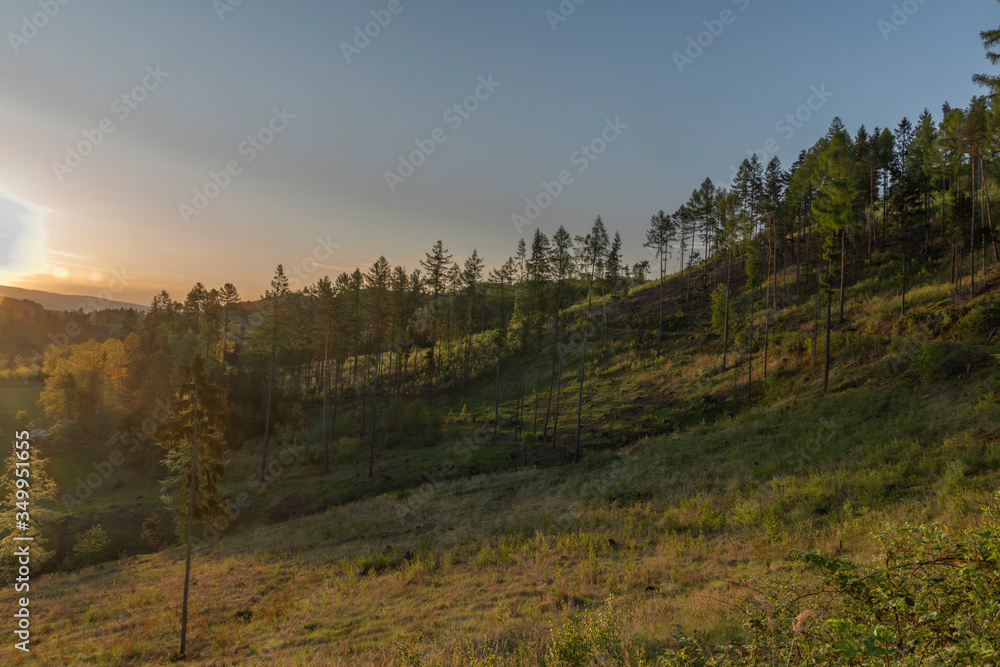Sunrise near Vidce village in Beskydy mountains in spring sunrise morning