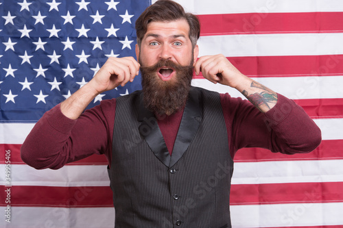 Yes, America Can. independence day. celebration of freedom. Patriotic education. hipster touch moustache. happy mature man at american flag. bearded man usa parliament representative. fourth of july photo