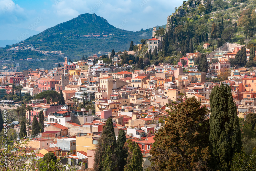 Aerial view of Old Town of Taormina in sunny day from Ancient Greek theatre, Sicily, Italy