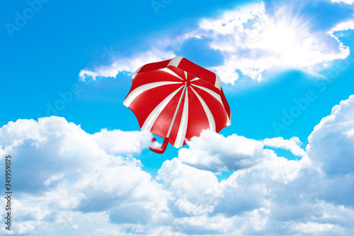 rot-wei   gestreifter Regenschirm fliegt aus den Wolken richtung Sonne. 3d rendering