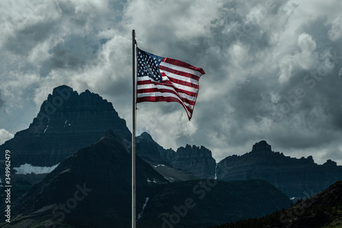 0000303_Old Glory, American Flag, waving over Swiftcurrent lake atGlacier National Park, Montana_2709