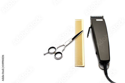 hair clipper comb and scissors isolated on white background