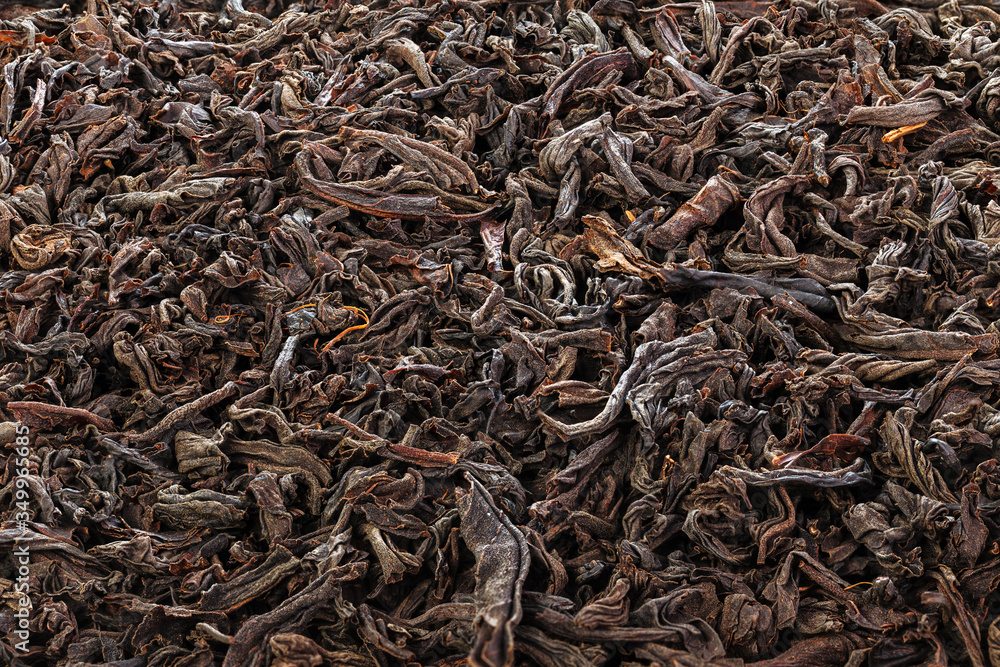 Dried Tea Leaves. The texture of large leaf black tea. Closeup. Full depth of field. Dried Tea Leaves. The texture of large leaf black tea. Closeup. Full depth of field.