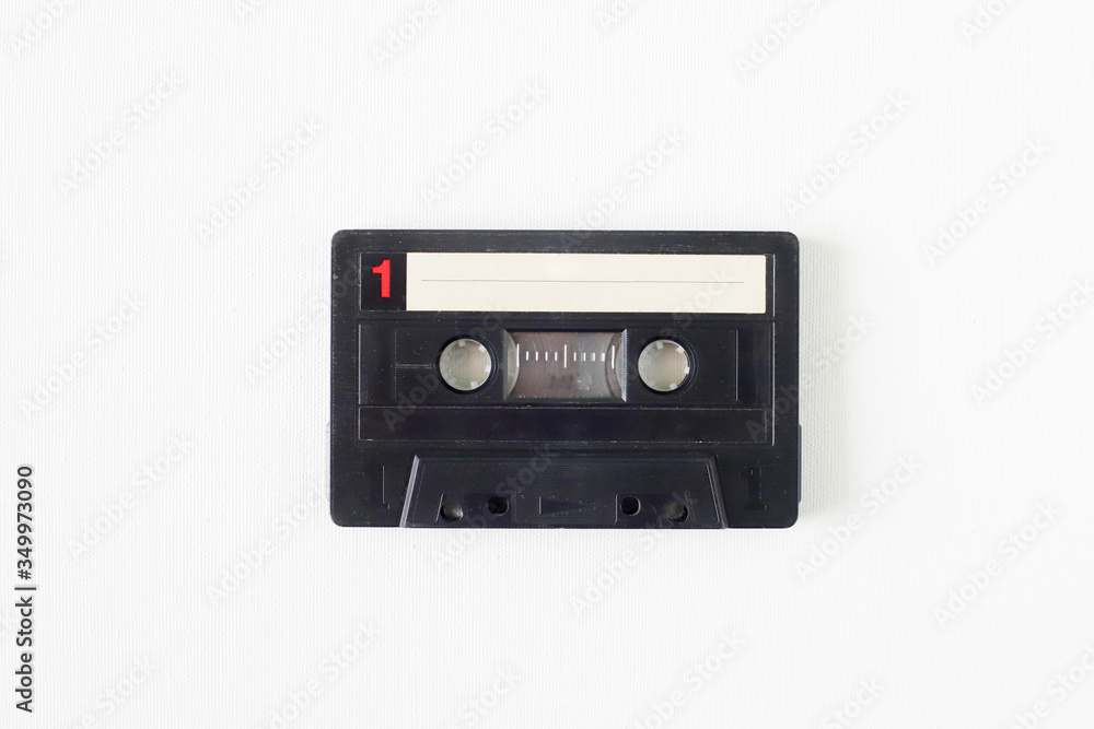 Old tape cassette, old or aged wood background. İsolated casette