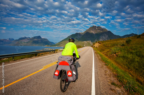 Biking in Norway against picturesque landscape. Bike, active.