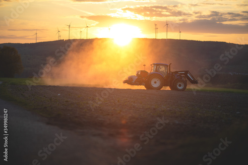 Farmer on a tractor, spring sowing, agricultural fields.