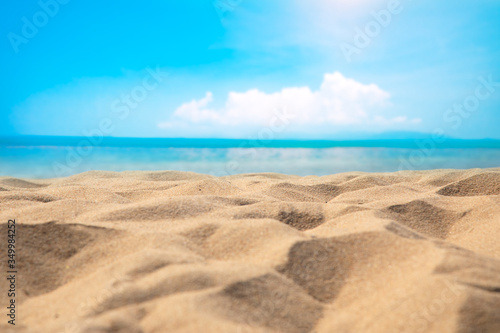 Blur defocused background of tropical beach and blue sea and sky with white cloud