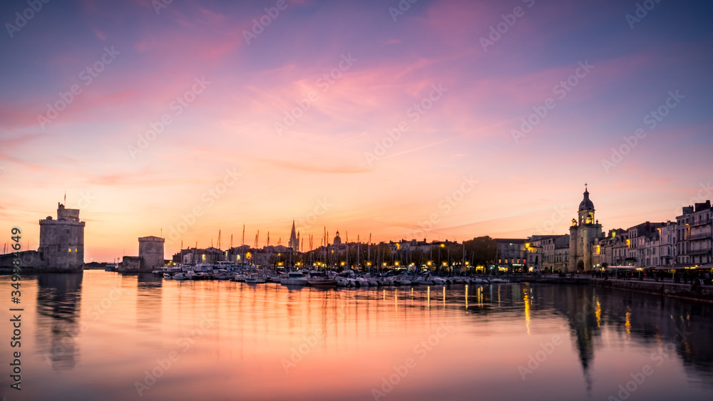 Old harbour of La Rochelle at sunset, the French city and seaport. beautiful colorful  sky and clouds. long exposure photography