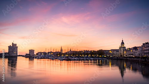 Old harbour of La Rochelle at sunset, the French city and seaport. beautiful colorful sky and clouds. long exposure photography