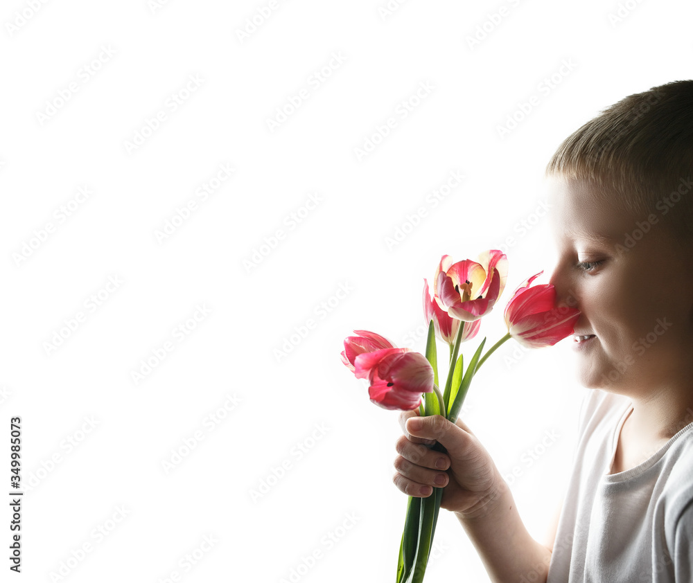Boy with bouquet of tulips on isolated background Boy with bouquet of tulips on isolated background