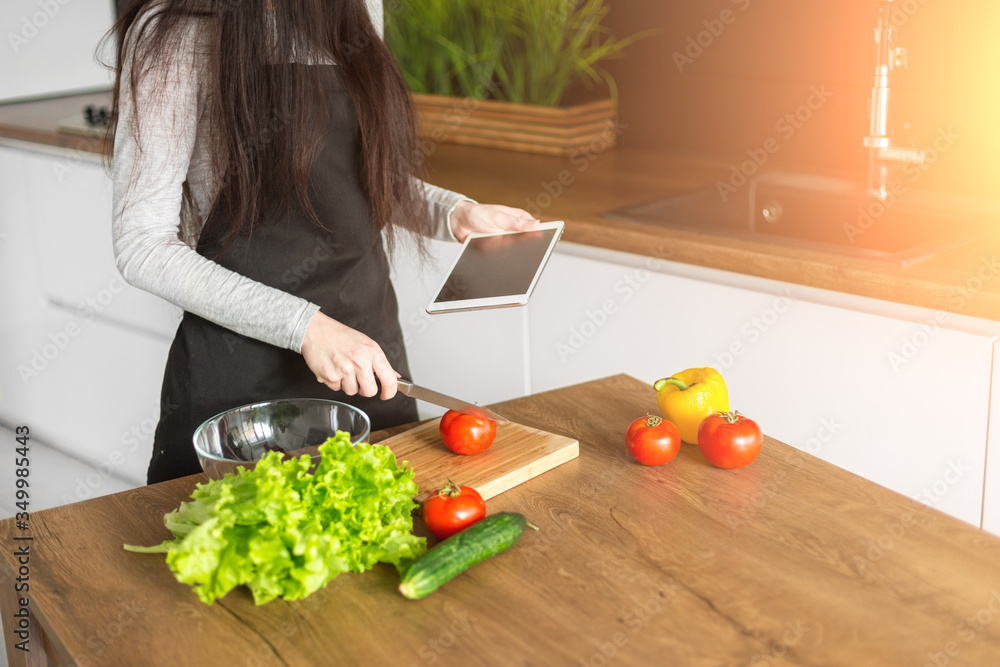 Young trendy woman cooking healthy food in the morning Young trendy woman cooking healthy food in the morning