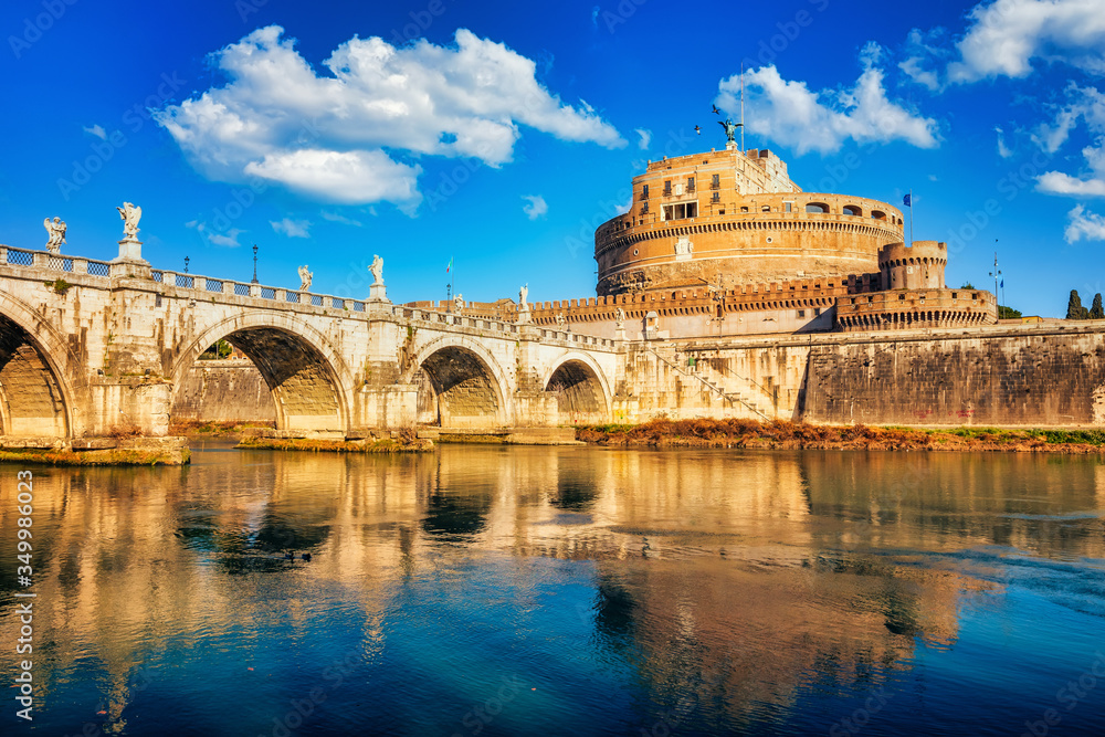 Saint Angel Castle and bridge over the Tiber river in Rome at sunny day