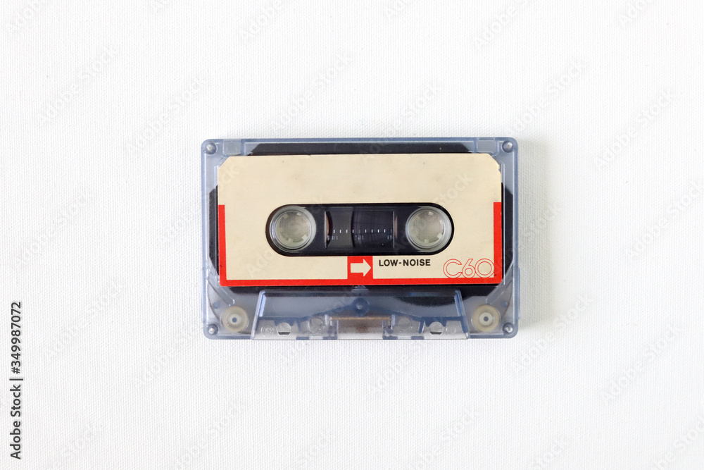 Fototapeta premium Old tape cassette, old or aged wood background. İsolated casette