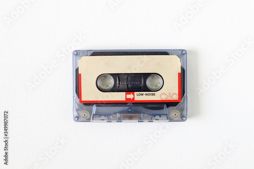 Old tape cassette, old or aged wood background. İsolated casette