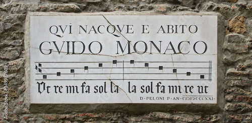 Commemorative sign of monk Guido Monaco, inventor of musical notation. Arezzo, Italy. Guido Monaco was born and lived here. 