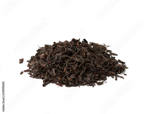 dry black long leaf tea, top view, ingredients for a hot drink