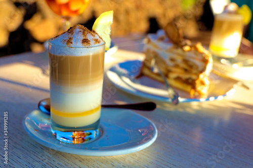 Zaperoco caffee and cake on the table in golden sun. Tenerife,  Puerto de la Cruz, Tarao Garden. photo