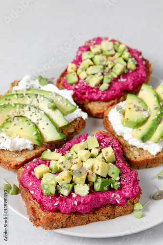 Variation of rye bread sandwiches with avocado beetroot and cream cheese