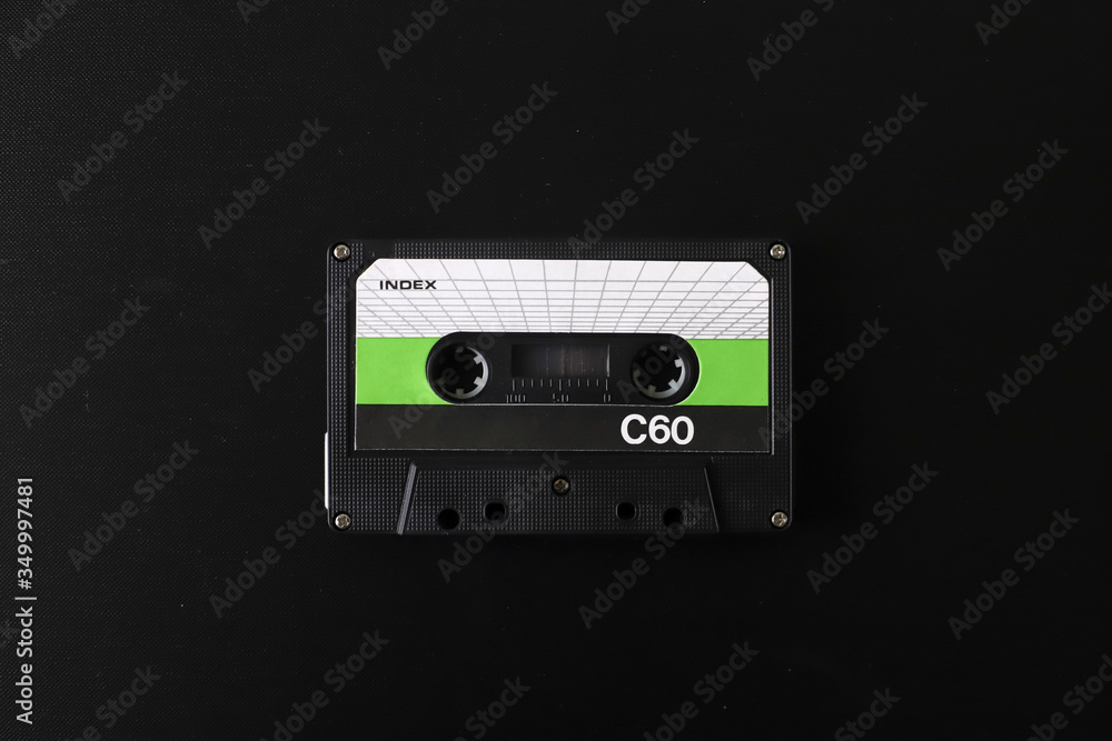 Fototapeta premium Old tape cassette, old or aged wood background. İsolated casette