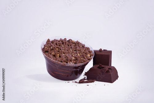 cold chocolate cake and cookies in packaging with pieces of chocolate
