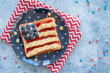 American flag toast with banana, strawberry jam and blueberry for breakfast