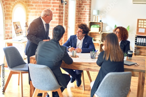 Group of business workers working together in a meeting. Listening one of them speaking at the office.