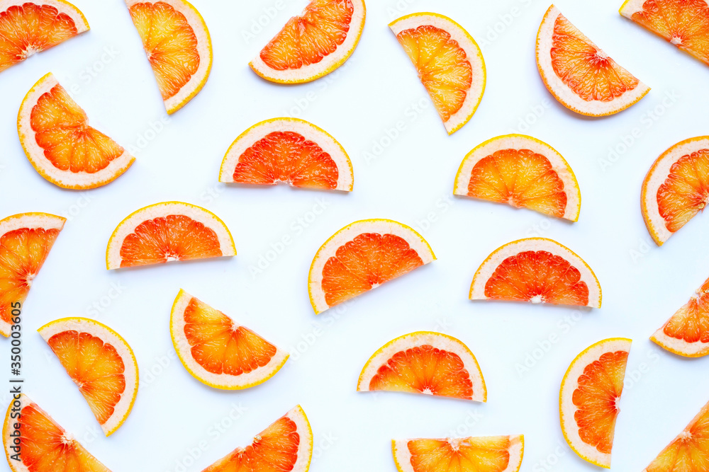 High vitamin C. Juicy grapefruit slices on white background. High vitamin C. Juicy grapefruit slices on white background.