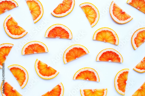 High vitamin C. Juicy grapefruit slices on white background.