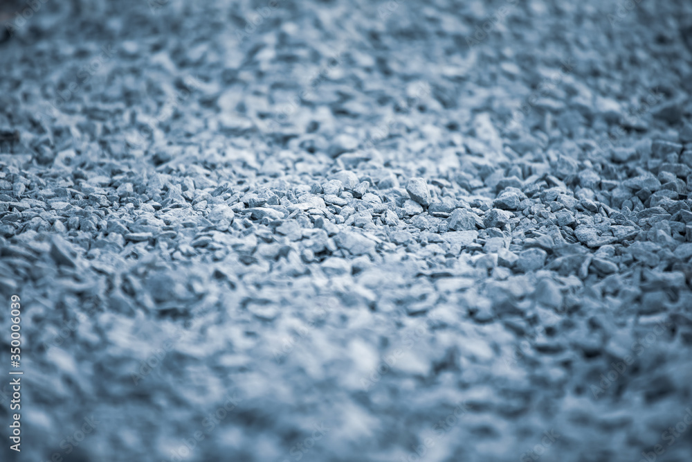 Background of pebbles. Pebble texture with a blue tint. Decorative rocks. Blue stone floor in the garden. Blue pebbles. Background of pebbles. Pebble texture with a blue tint. Decorative rocks. Blue stone floor in the garden. Blue pebbles.