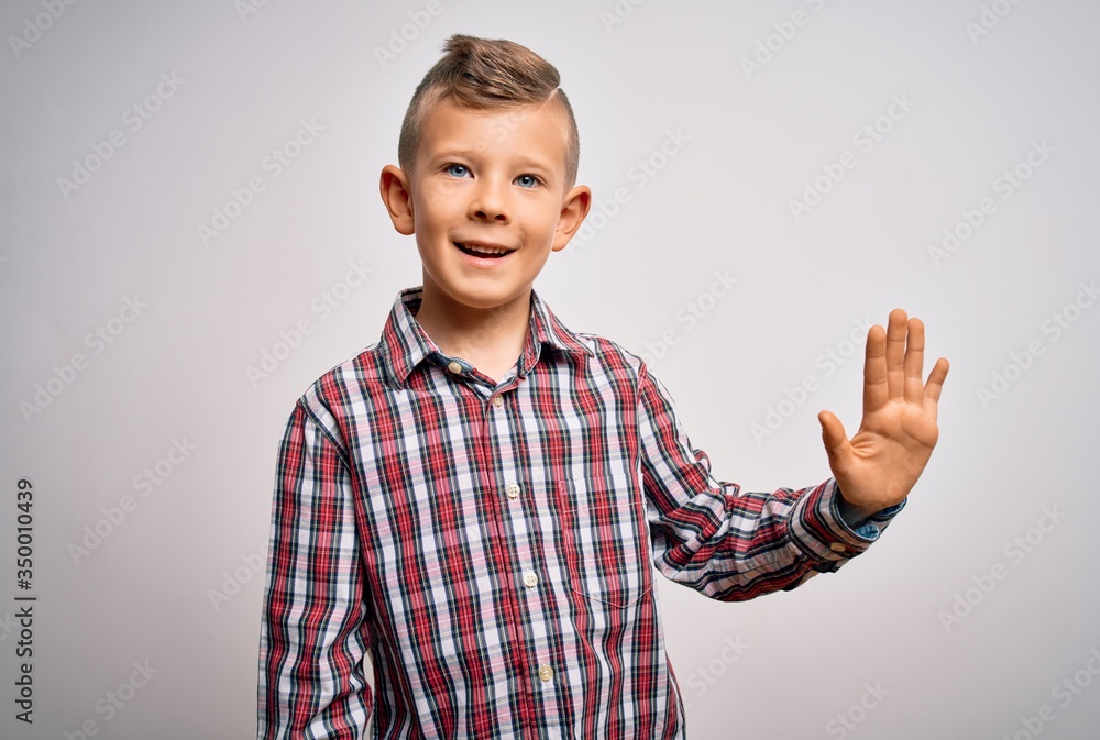 Young little caucasian kid with blue eyes wearing elegant shirt standing over isolated background showing and pointing up with fingers number five while smiling confident and happy. Young little caucasian kid with blue eyes wearing elegant shirt standing over isolated background showing and pointing up with fingers number five while smiling confident and happy.