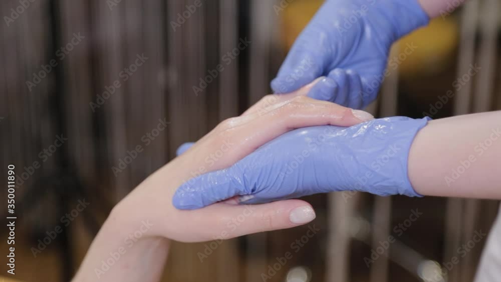 Professional beautician does palm massage during the procedure. Professional beautician does palm massage during the procedure.