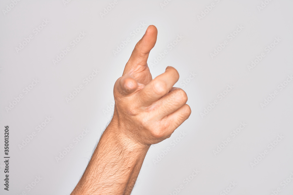 Hand of caucasian young man showing fingers over isolated white background pointing forefinger to the camera, choosing and indicating towards direction Hand of caucasian young man showing fingers over isolated white background pointing forefinger to the camera, choosing and indicating towards direction