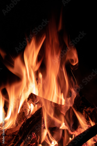 Yellow flames burning on a dark background