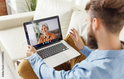 Man making video call to mother.