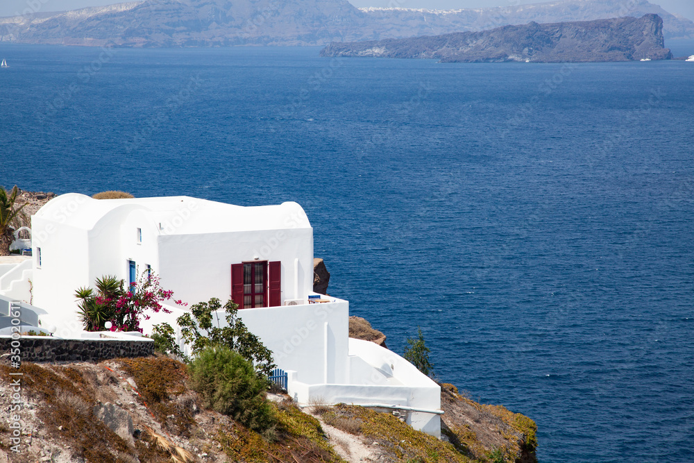 Fototapeta premium traditional white architecture over the Caldera, Aegean sea. Scenic travel background, Santorini