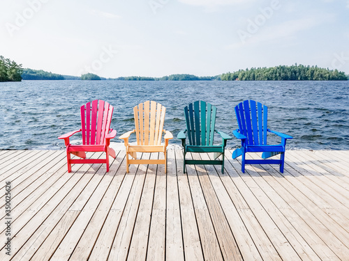Leinwand Poster chairs by the lake cottage country