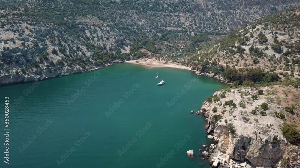 scenic aerial view of a yacht between reefs in a bay on a greek island thasos scenic aerial view of a yacht between reefs in a bay on a greek island thasos