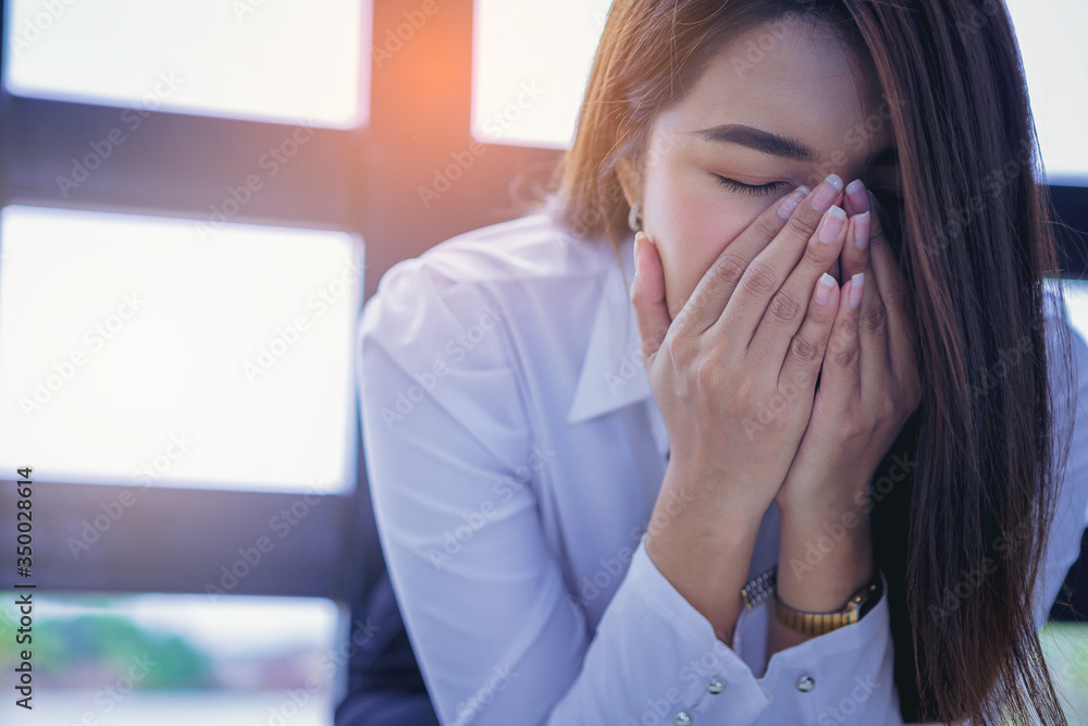 Young woman touching her nose suffering from rhinitis snuffles, having respiratory infection, problems with the respiratory system Young woman touching her nose suffering from rhinitis snuffles, having respiratory infection, problems with the respiratory system