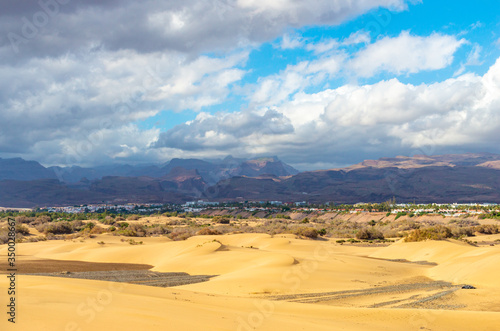 Maspalomas dunes with the center of the island of Gran Canaria in the background