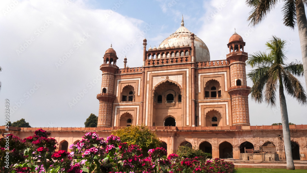 safdarjung's tomb with a flower bed in the foreground at delhi