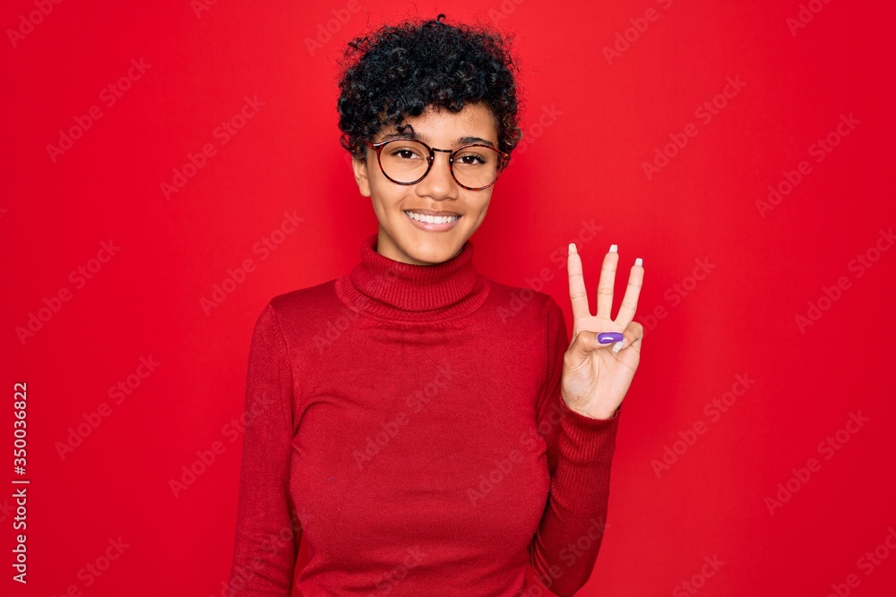 Young beautiful african american afro woman wearing turtleneck sweater and glasses showing and pointing up with fingers number three while smiling confident and happy. Young beautiful african american afro woman wearing turtleneck sweater and glasses showing and pointing up with fingers number three while smiling confident and happy.