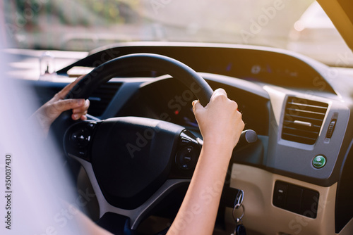 Hands woman holding steering wheel,Driving a car on road