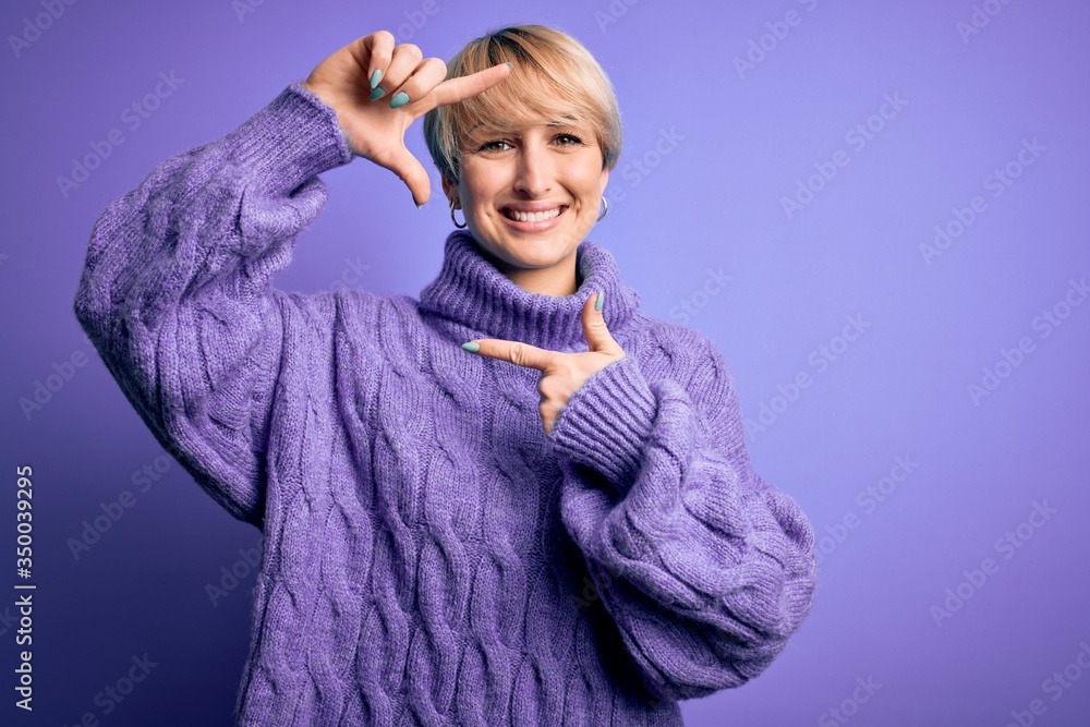 Young blonde woman with short hair wearing winter turtleneck sweater over purple background smiling making frame with hands and fingers with happy face. Creativity and photography concept. Young blonde woman with short hair wearing winter turtleneck sweater over purple background smiling making frame with hands and fingers with happy face. Creativity and photography concept.