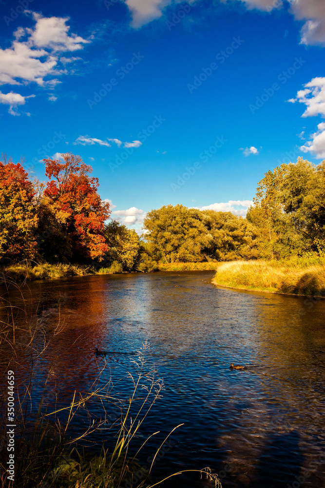 Fototapeta premium Calming fall evening and October skies at Credit River, Mississauga, Ontario, Canada